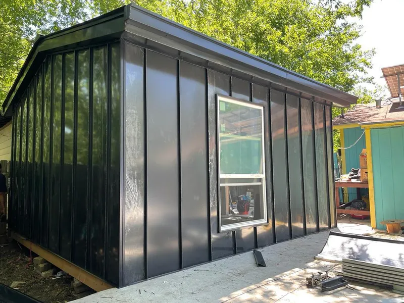 Black standing seam metal wall panels for Roof Inspection in Chelsea